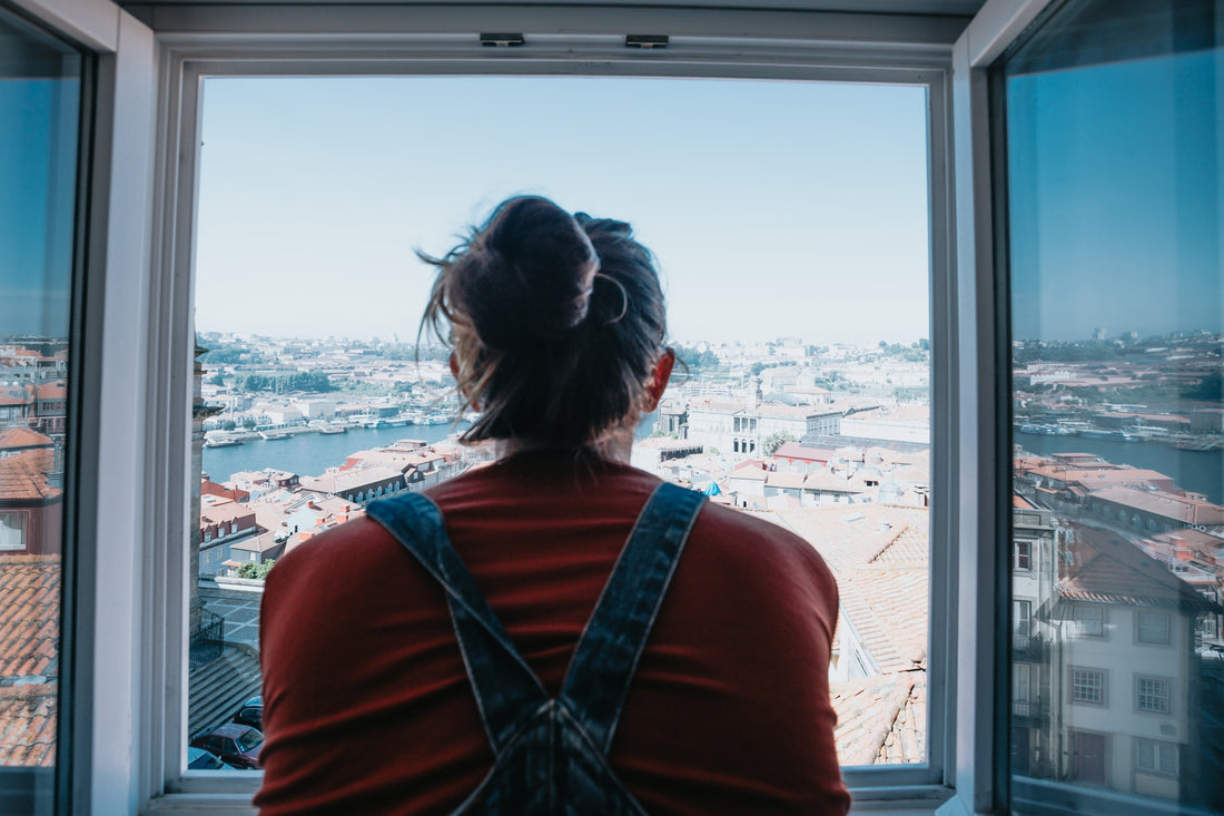 Woman looking out window — brain fog in women linked to iron and magnesium deficiency | SESA