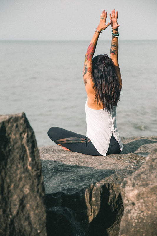 Woman doing yoga — SESA black sesame crunch supports energy and vitality for women in their 30s and 40s